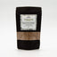 Recharge de cardamome verte en poudre Épices Moralès en sachet kraft noir, parfum floral intense pour desserts.
