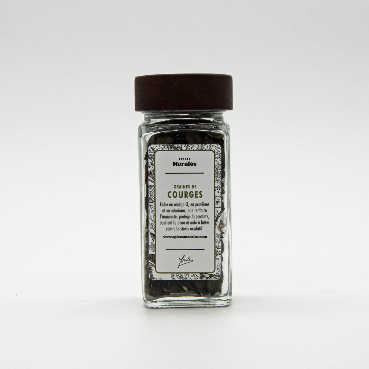 Fiole de graines de courge Épices Moralès, graines croquantes riches en nutriments pour salades et encas.