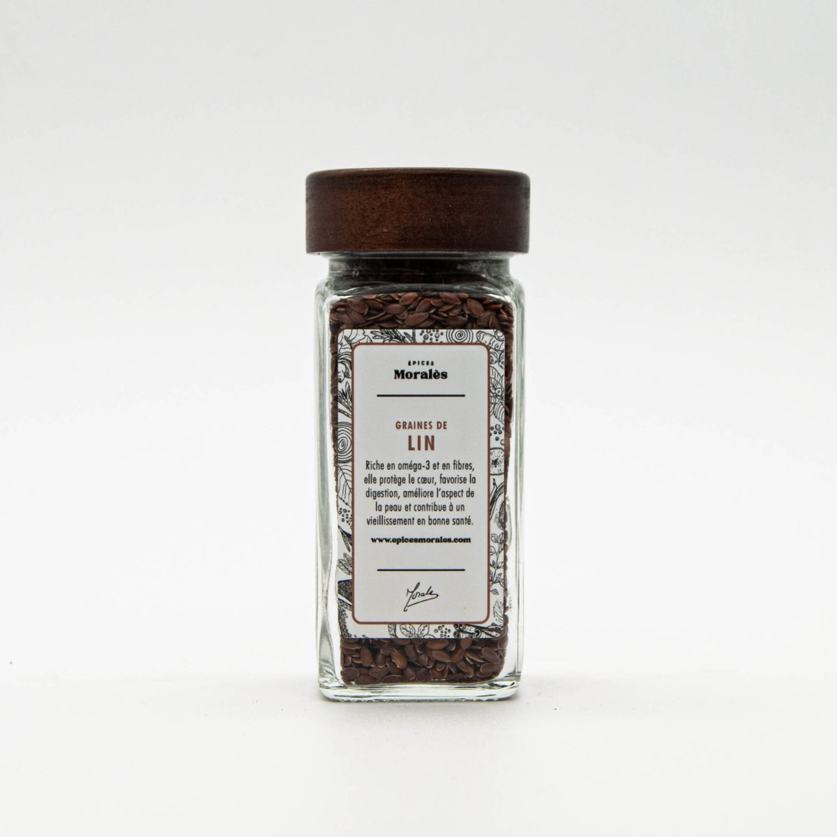 Fiole de graines de lin Épices Moralès, graines dorées riches en fibres et oméga-3 pour petits déjeuners et salades.
