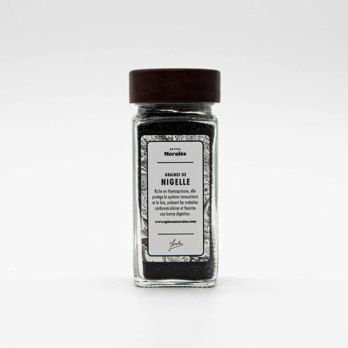 Fiole de graines de nigelle Épices Moralès, petites graines noires au goût légèrement piquant pour pains et plats orientaux.