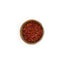 Bol de piment Ñora Épices Moralès vu du dessus, flocons rouges aux notes de poivron pour riz et ragoûts.